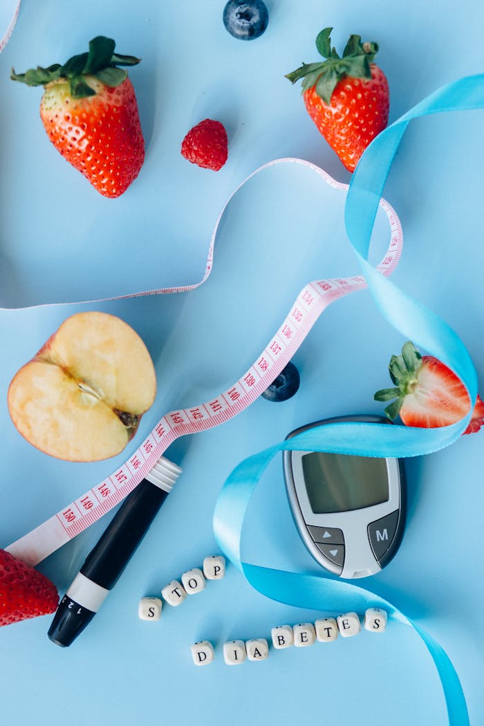 The Art of Drawing Readers In: Your attractive post title goes here Fruits, glucose meter, and ribbon on a blue background symbolize diabetes awareness and healthy living.